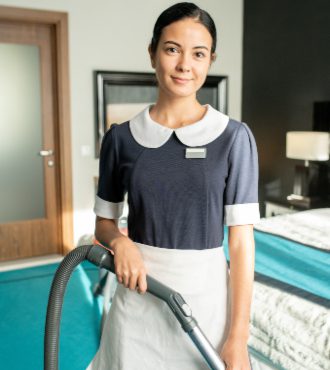 beautiful-chambermaid-with-vacuum-cleaner-2021-09-24-03-43-56-utc.jpg